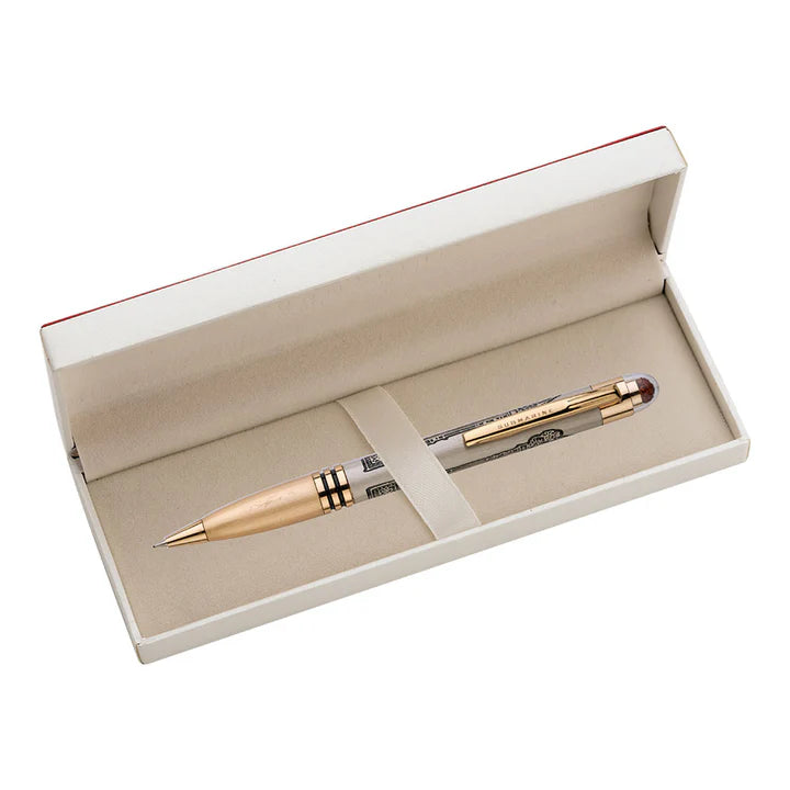 Gold pen in an open beige box on a white background