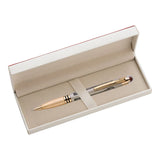 Gold pen in an open beige box on a white background
