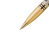 Close-up of a gold pen tip on a white background