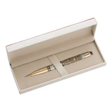 Decorative pen in a beige box on a white background
