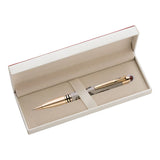 Gold pen in an open beige box on a white background