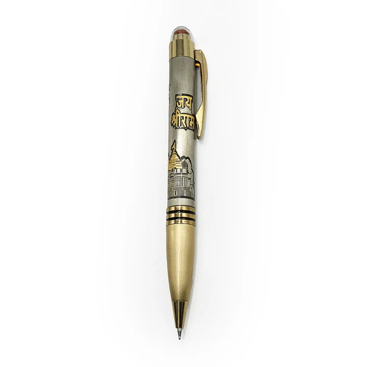 Decorative pen with gold and silver design on a white background