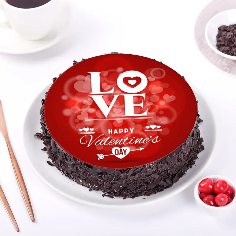 Chocolate Truffle Valentine Cake with red heart-themed frosting and 'LOVE Happy Valentine's Day' message, perfect for romantic celebrations.