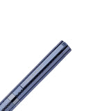 Black telescope barrel with focus and zoom controls on a light gray background