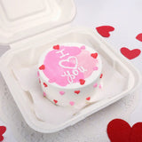 Heart-themed Lovely Pineapple Cake -valentine photo cake in white box, topped with pink icing and butterscotch filling, perfect for Valentine's Day.