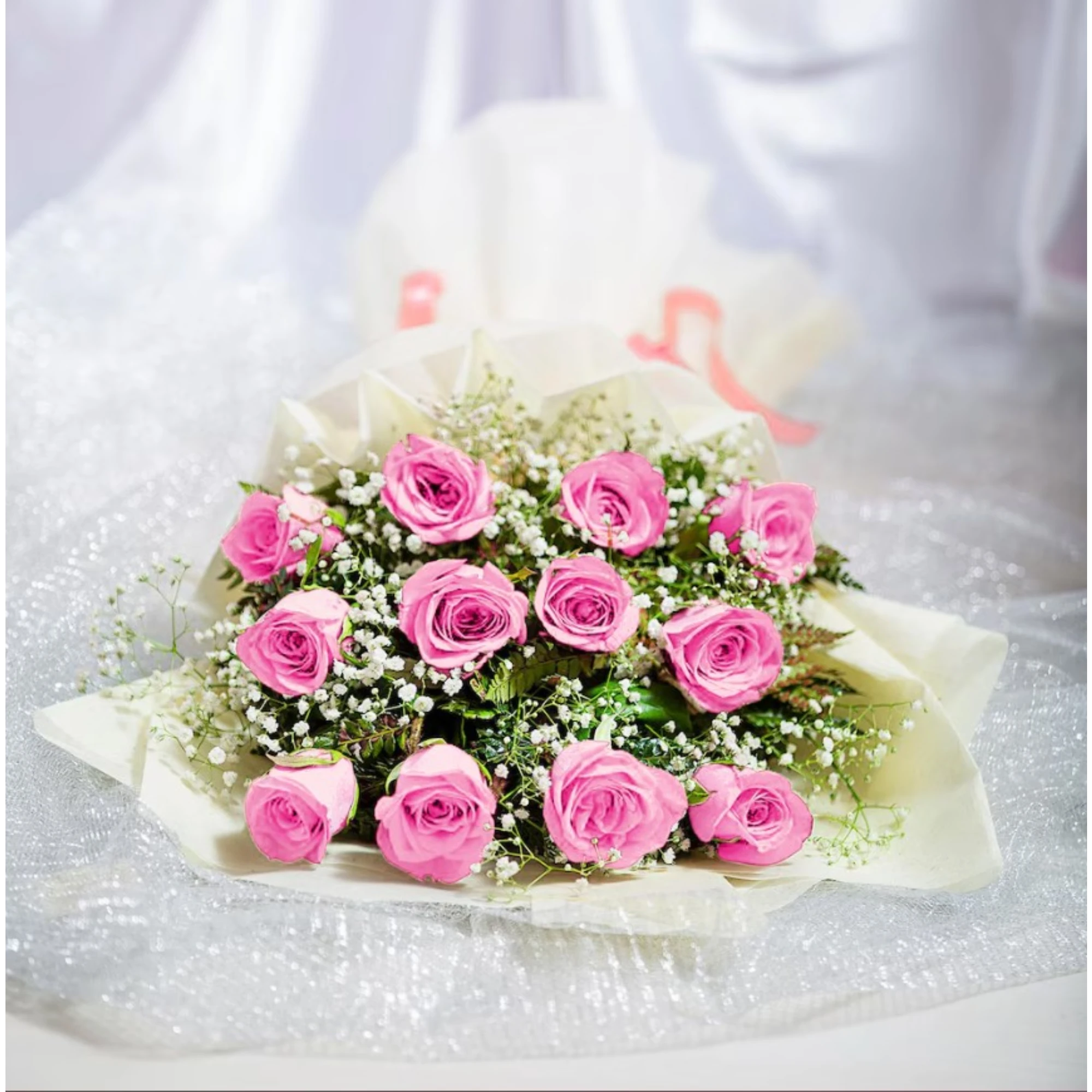 Elegant pink roses bouquet with white baby's breath