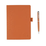 Orange notebook with matching pen on a white background