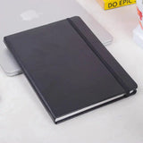 Black Fluct A5 Diary with a premium textured cover lying closed on a desk
