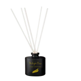 Black scented diffuser with white sticks on a white background
