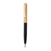 Pen with gold and black design on a white background