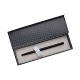 Black pen in a textured case on a white background
