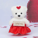 White teddy bear with red heart and skirt holding 'I Love You' sign, part of personalized teddy gift set in pinewood tray.