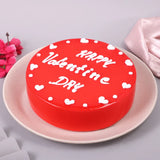 Valentines Special Black Forest Cake - Valentine's Day Cakes Online in glossy red glaze with white heart decorations and 'Happy Valentine Day' text.