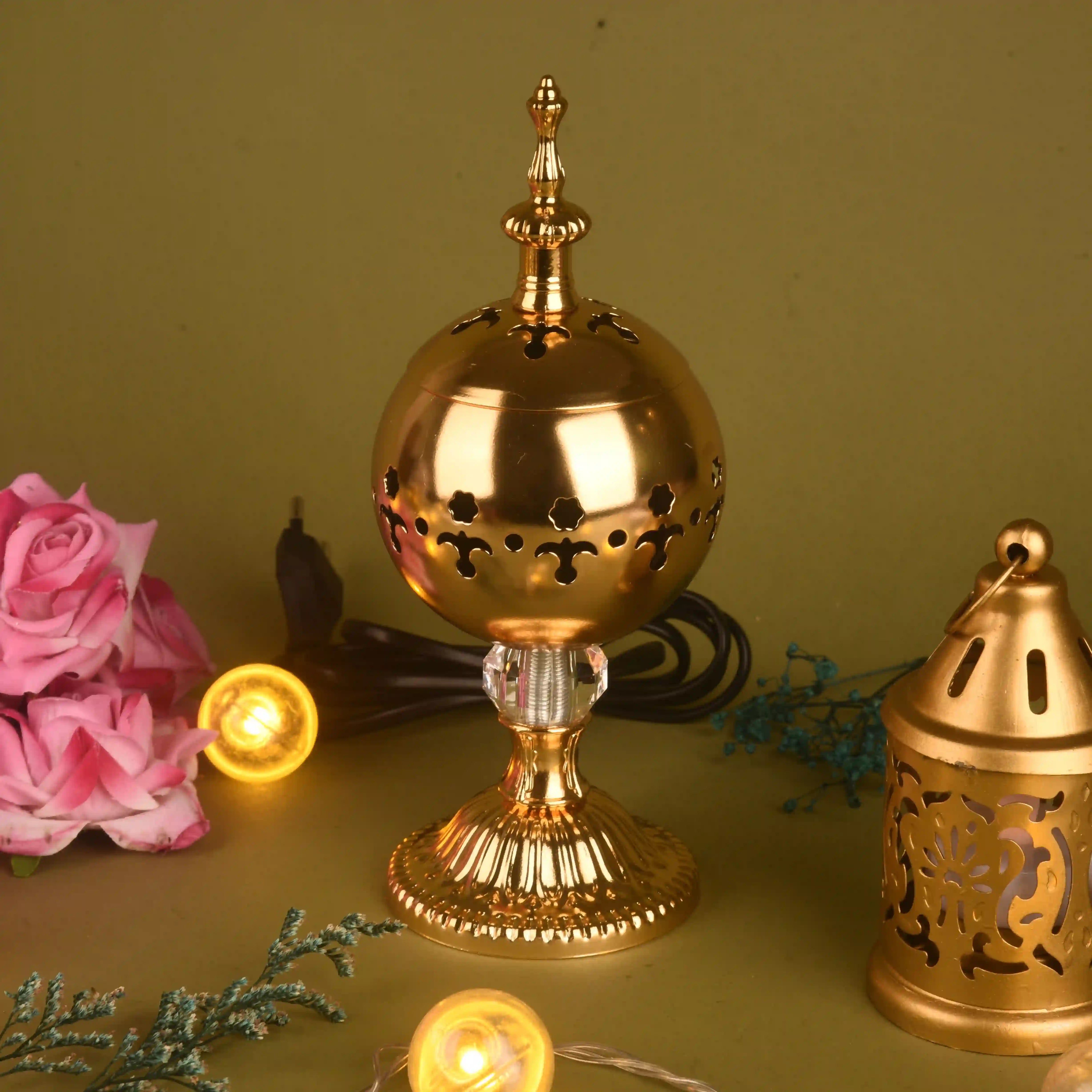 Decorative gold lantern with floral and string light background