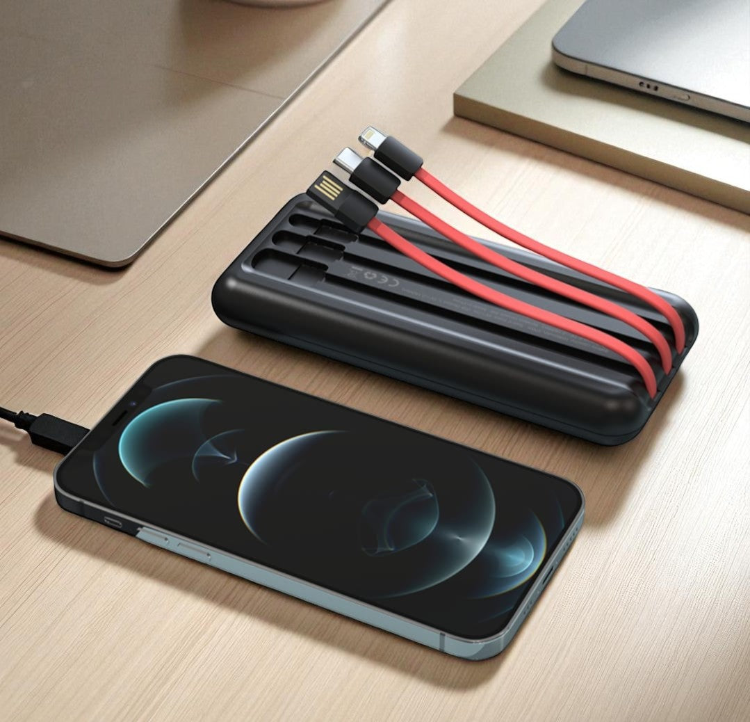 Black charging cable organizer with multiple cables on a wooden surface