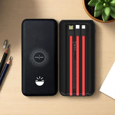 Black power bank with red cable heads on a wooden surface