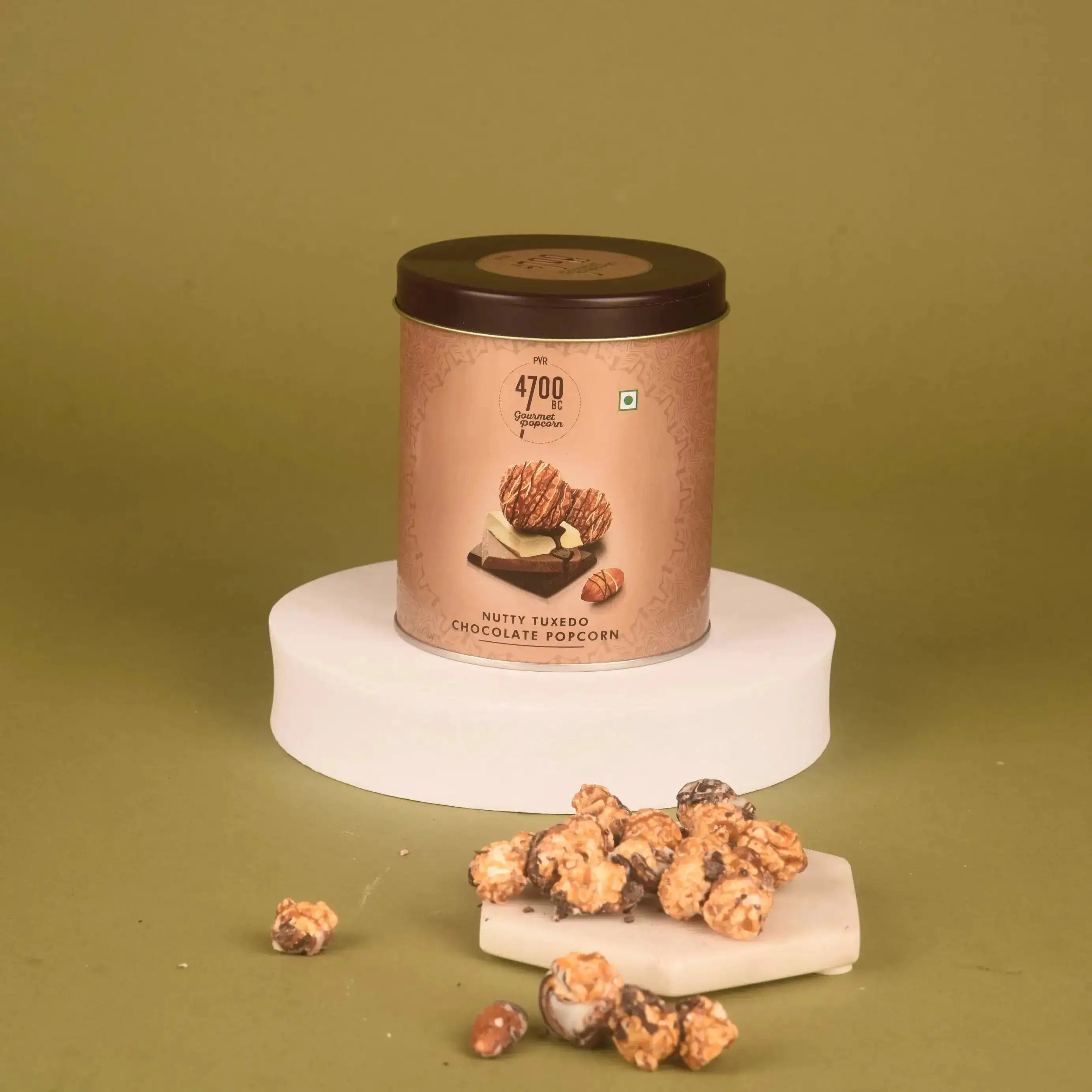 Nutty Tuxedo Chocolate Popcorn tin from the Beats & Bytes Diwali Gift Hamper, a gourmet snack for festive indulgence.