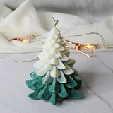 Christmas Tree Scented Candle in green and white gradient with pine-inspired layers, ideal for festive home décor and holiday ambiance.