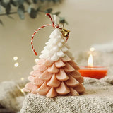 Christmas Tree Scented Candle in festive orange and white gradient with bell ornament, perfect for holiday home décor and gifting.