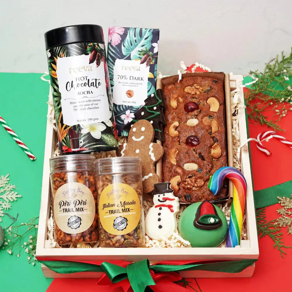 Festive Christmas Gift Hamper - Treat Treasury packed with gourmet delights like hot chocolate, trail mix, and decorative holiday sweets.