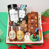 Festive Christmas Gift Hamper - Treat Treasury packed with gourmet delights like hot chocolate, trail mix, and decorative holiday sweets.