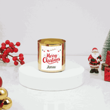 Gold candle with 'Merry Christmas Arnav' text, surrounded by Christmas decorations on a white background