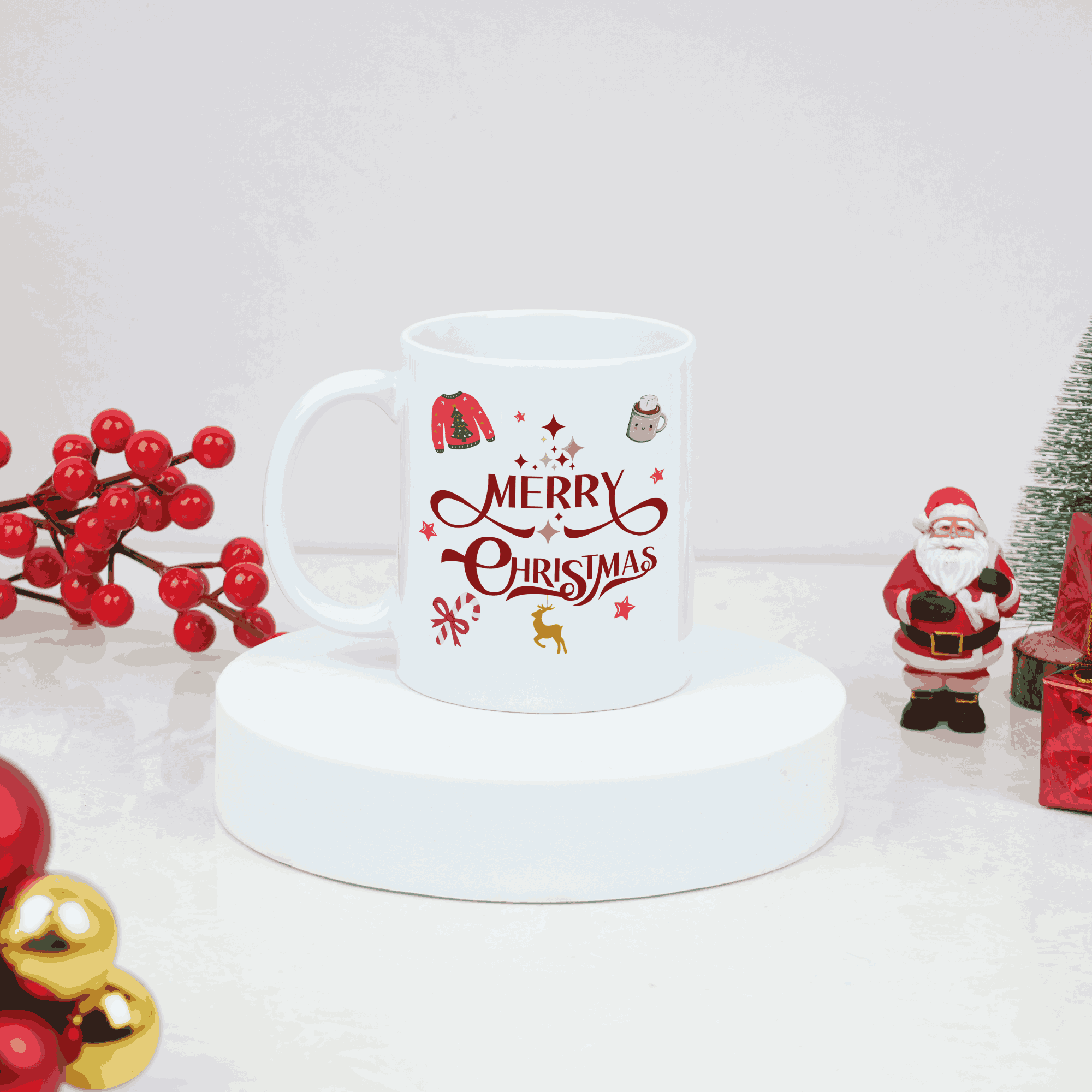 White mug with 'Merry Christmas' text and festive designs on a white surface with holiday decorations.