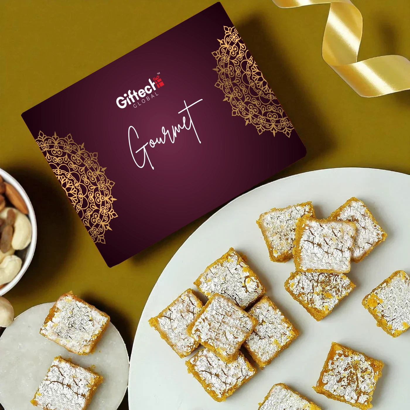 Gourmet dessert squares on a plate with a Gifteee packaging box in the background.