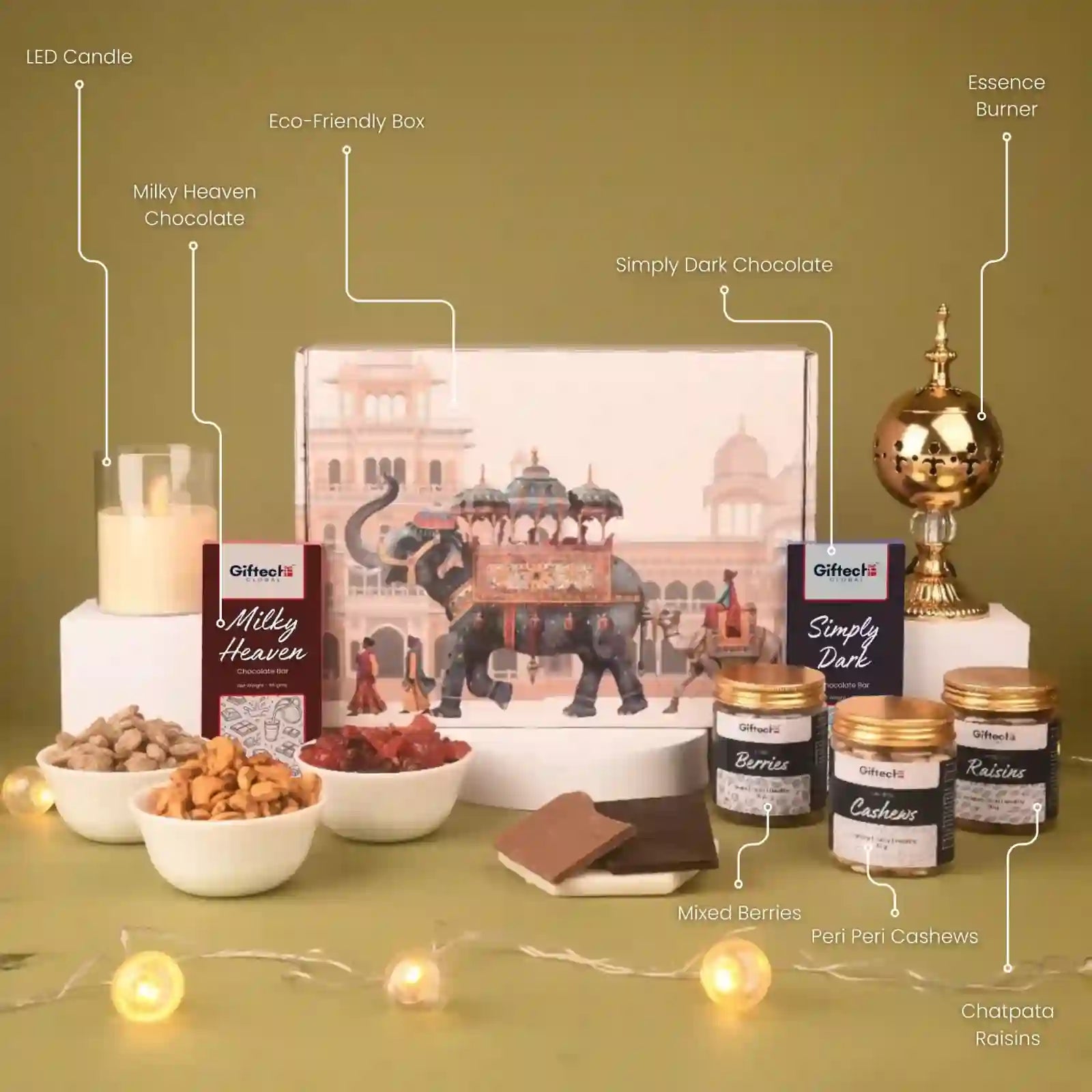 Gourmet gift set with chocolates, nuts, and a decorative box on a green background