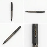 A direct, front-on vertical view of the capped pen, standing perfectly upright. The full length is visible, showing the smooth black cap and the detailed, patterned barrel.