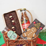 Gourmet Christmas Hamper Gift Set with rich plumcake, granola jar, masala nuts, and gingerbread chocolate, ideal for festive gifting.
