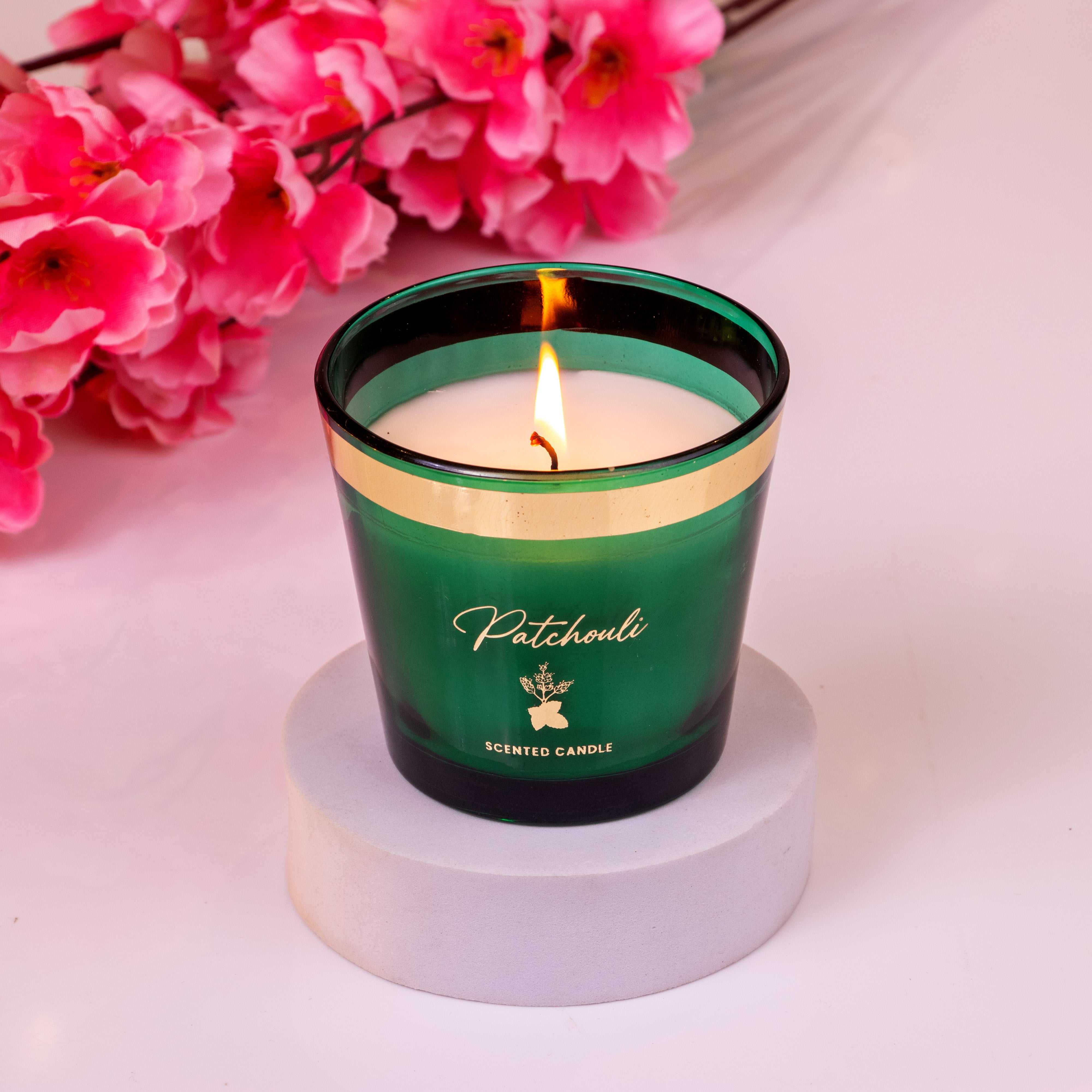 Eco-friendly patchouli scented candle emitting calming aroma for relaxation and aromatherapy benefits