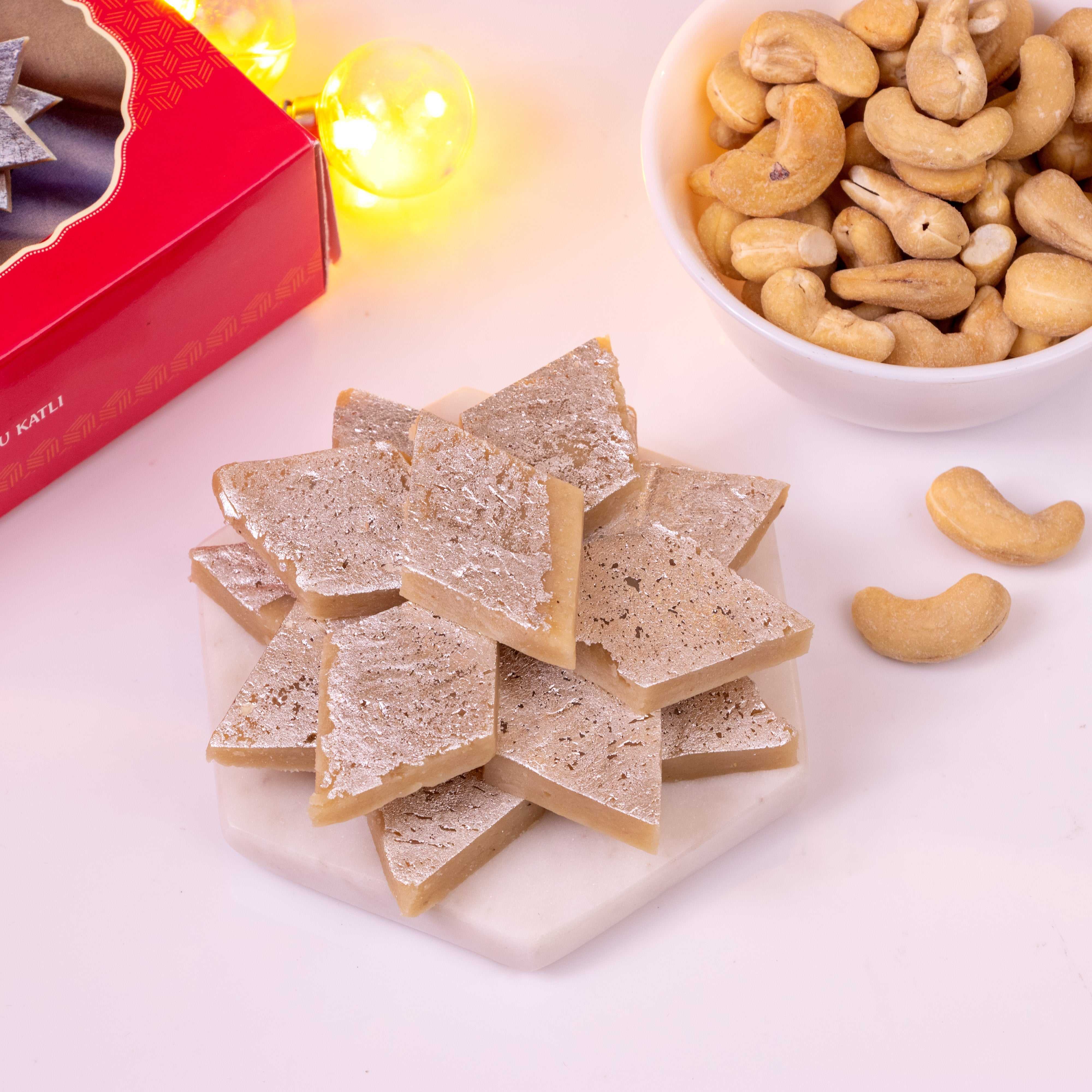 Box of authentic Kaju Katli 200gms featuring smooth, diamond-shaped cashew nut sweets perfect for festive gifting and celebrations.