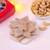 Box of authentic Kaju Katli 200gms featuring smooth, diamond-shaped cashew nut sweets perfect for festive gifting and celebrations.