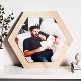 Single hexagon wood photo frame from the Trio Photo Wall Frame Set - Best Of Us, placed on a shelf with a cozy couple photo inside.