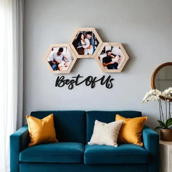 Trio Photo Wall Frame Set - Best Of Us mounted above a teal sofa with yellow cushions, showcasing three hexagon wood frames and black acrylic text.