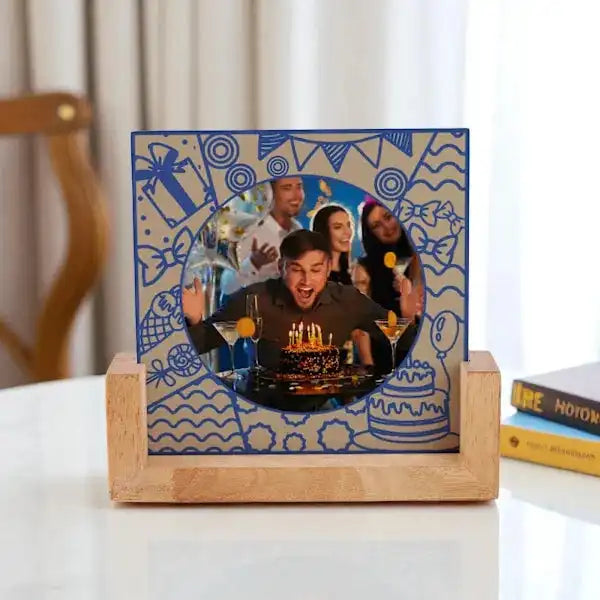 Personalized Birthday Frame - Photo Keepsake for Him featuring a man blowing candles, set in a blue doodle design with wooden stand.