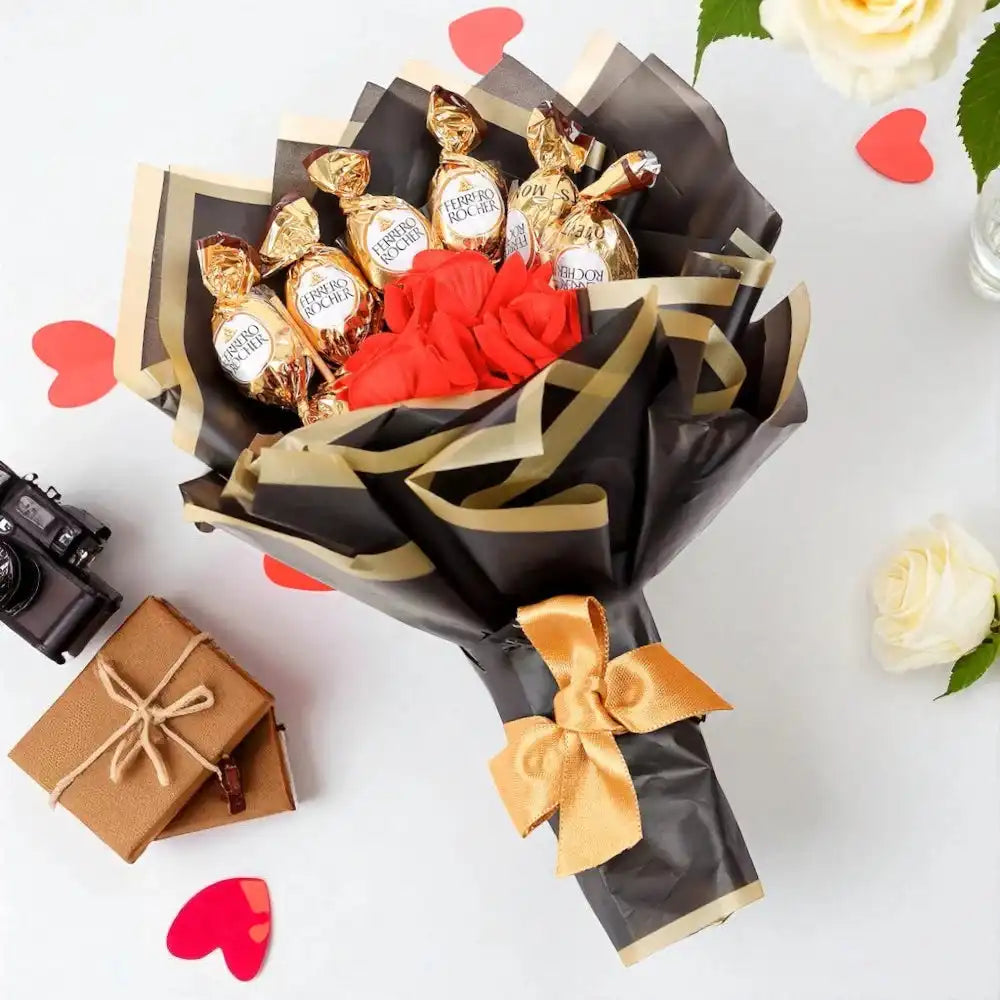 Chocobliss Bouquet Gift with Ferrero Rocher and roses on a white surface with hearts and roses. A romantic chocolate bouquet for gifting.