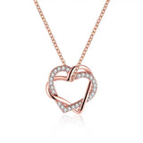 Close-up of rose gold heart pendant with sparkling crystals on fine chain, a durable and stylish gift for anniversaries or birthdays.