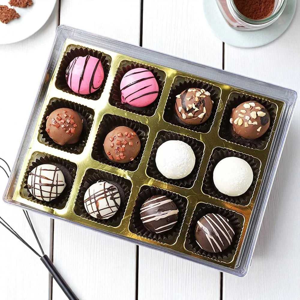 Delight Chocolate Box - Gourmet Gift with 12 assorted truffles in a gold tray, featuring nut toppings and decorative drizzles.