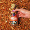 Close-up of Granola Cashew Raisin jar from Graceful Indulgence Hamper, featuring a tropical floral label and premium ingredients for gourmet gifting.
