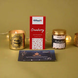 Gifteeh Global products including a candle, chocolate bar, and card on a green background