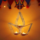 Decorative hanging lamp with candles on an orange background