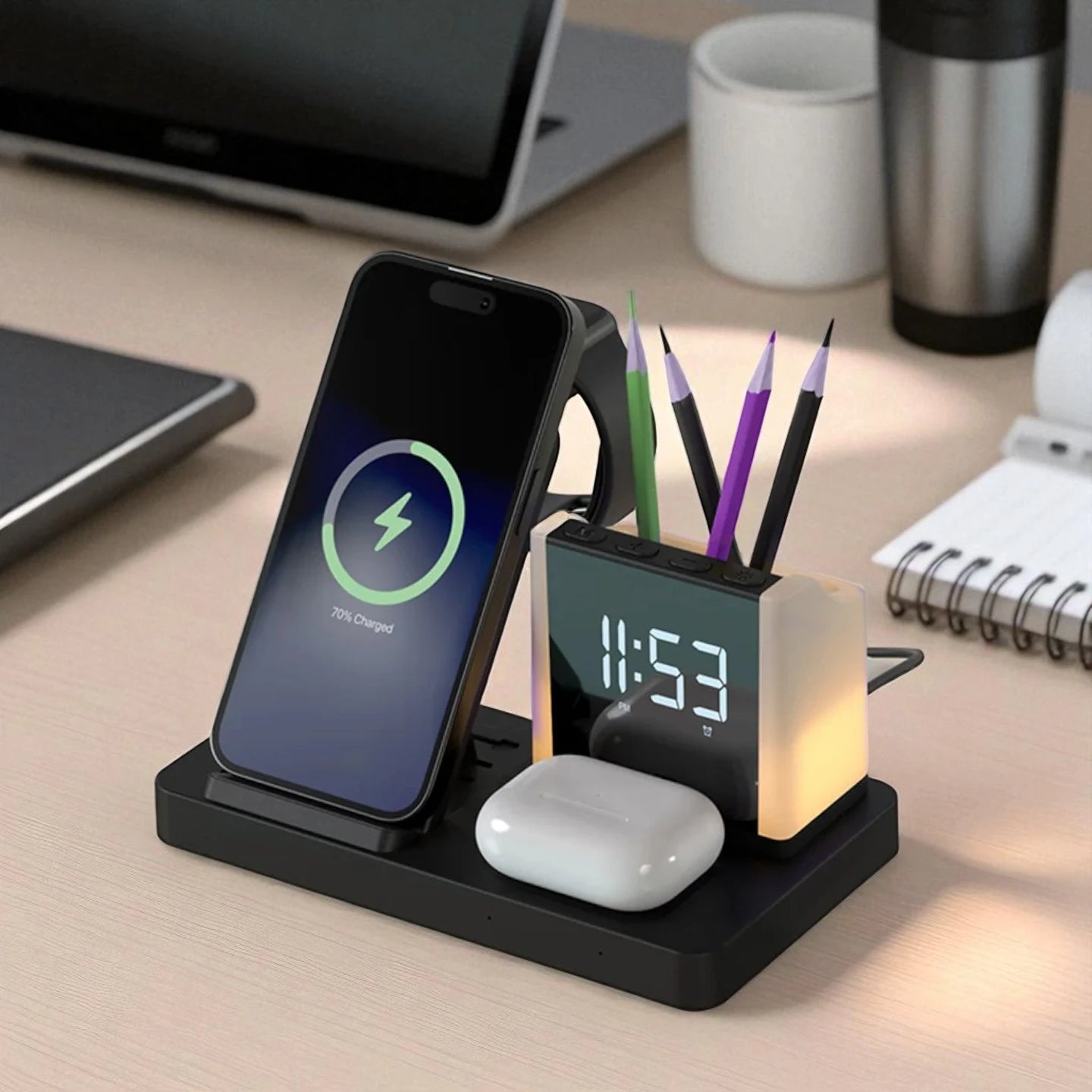 Desk organizer with phone charging station, clock, and pen holder on a desk.