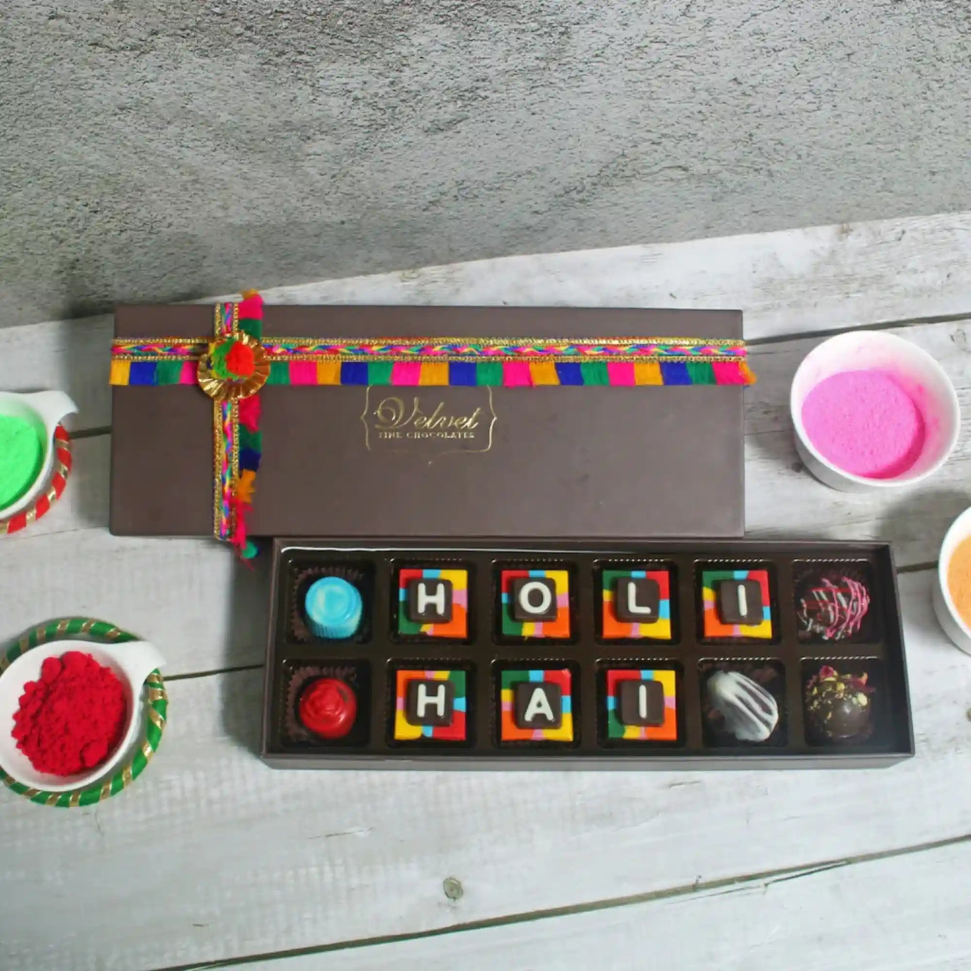 Gift box of Holi chocolates with vibrant packaging and decorative ribbons for festive occasions