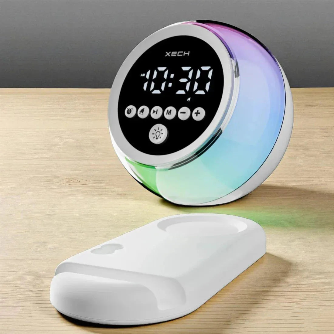 Digital clock with RGB lighting on a wooden surface