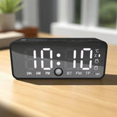 Digital clock with multiple functions on a wooden surface