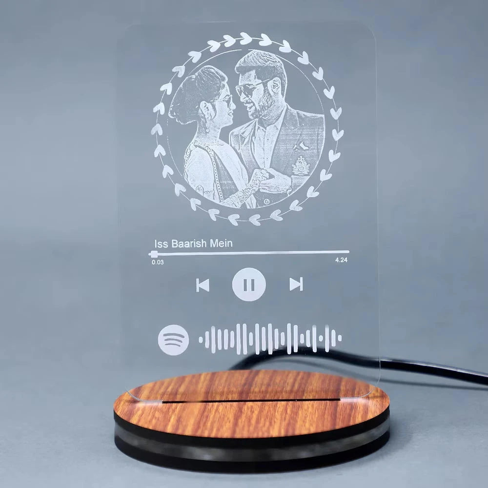 Acrylic engraved LED lamp for couples featuring custom photo and music code, set on a wood-textured base, perfect for anniversary gifts.