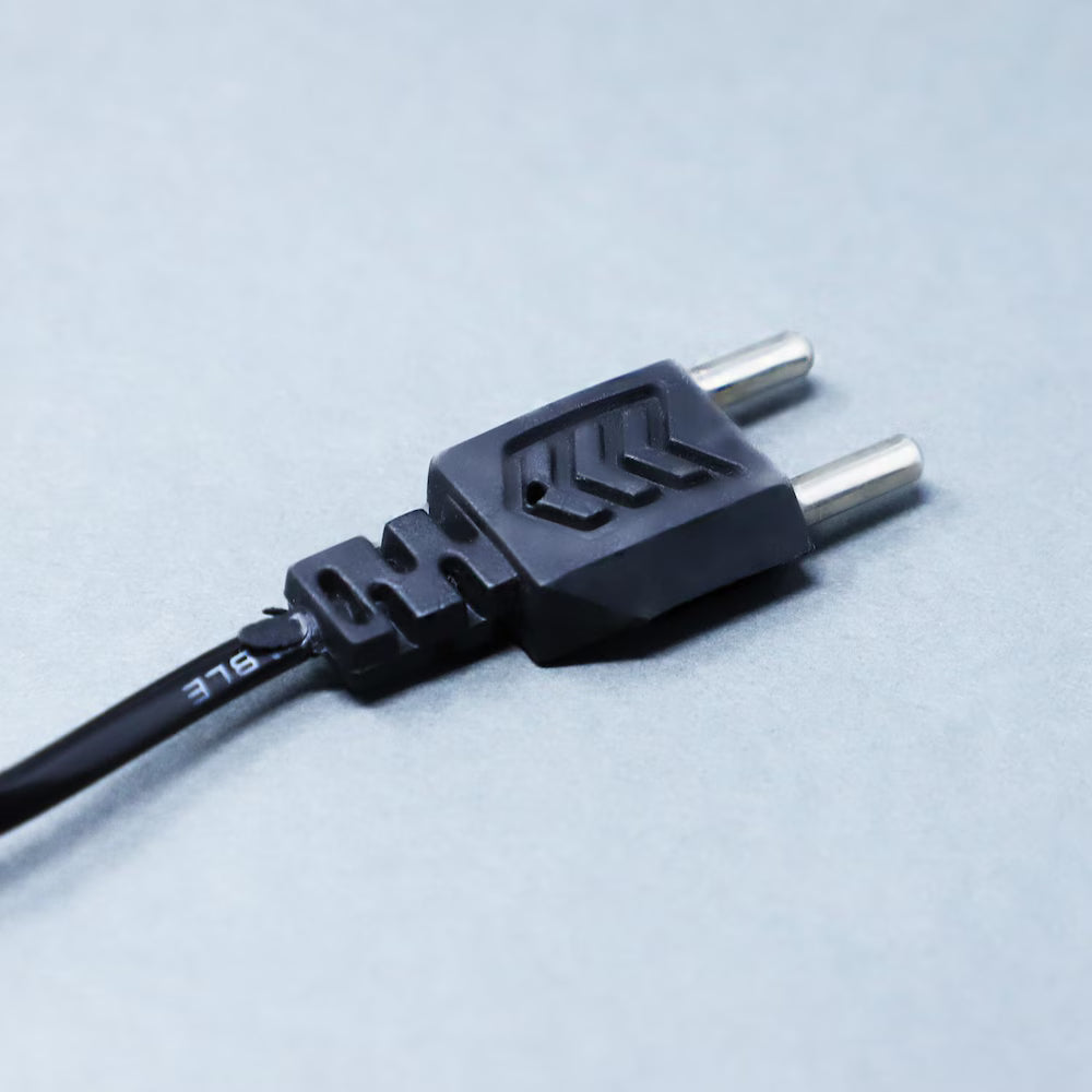 Close-up of the LED lamp's power plug with dual-pin design, compatible with standard home sockets for easy setup and use.