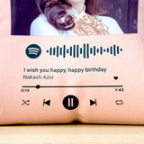 Close-up of Spotify Birthday Cushion showing custom song code, track title 'I wish you happy, happy birthday' by Nakash Aziz, and music controls.
